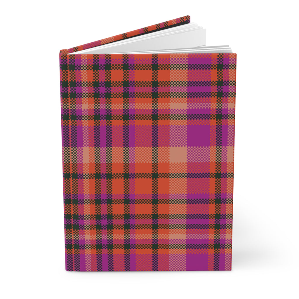 A hardcover notebook or journal standing upright, featuring a vibrant plaid pattern in purple, orange, red, and black on a clean white background.