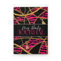 A hardcover daily journal with a black cover featuring a vibrant pink zebra print, gold chain patterns, and small gold tassels, with a central black band reading 'My Daily JOURNAL' in white and pink script.
