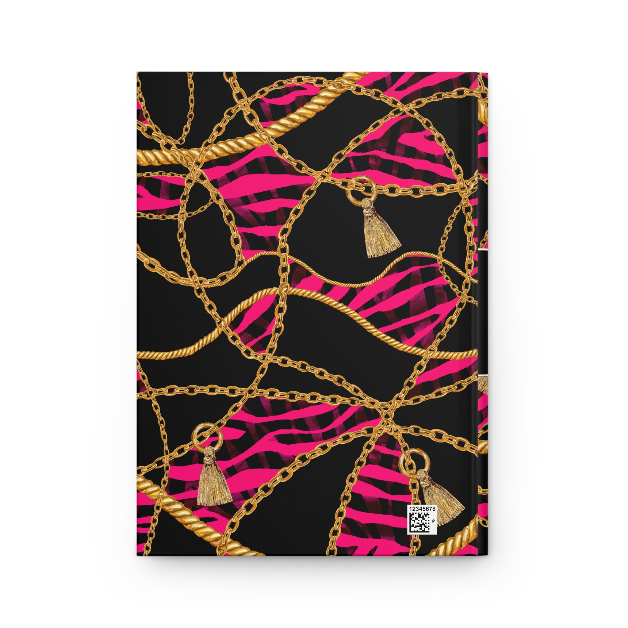 A hardcover notebook with a bold pattern featuring gold chains, gold tassels, and hot pink zebra stripes on a black background, shown against a plain white backdrop.