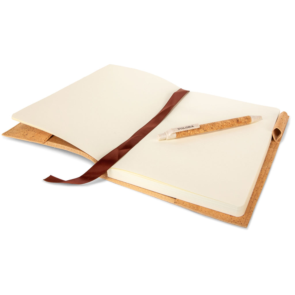 Open notebook with a pen on a white background