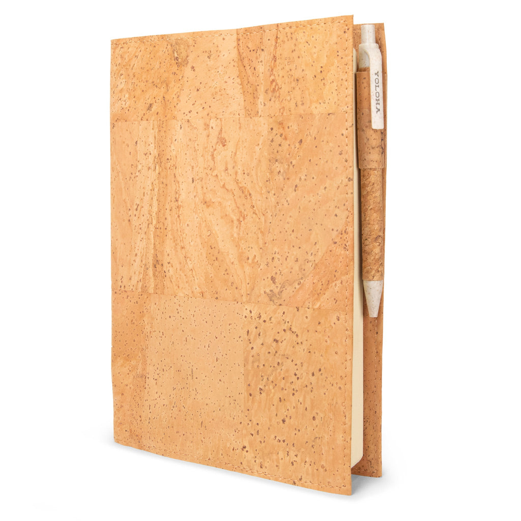 Cork notebook with a white strap on a white background