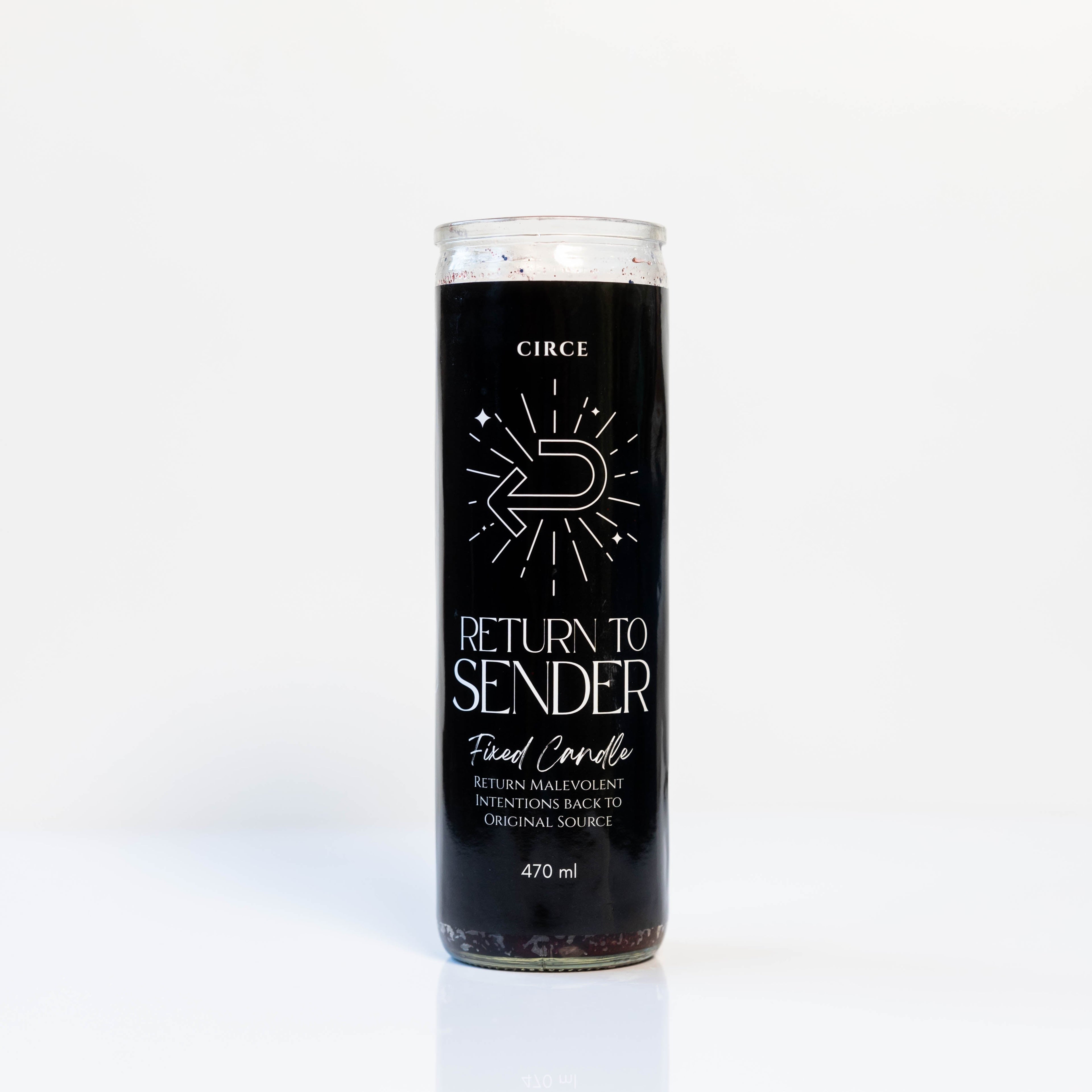 Candle with black label featuring text and a logo on a white background