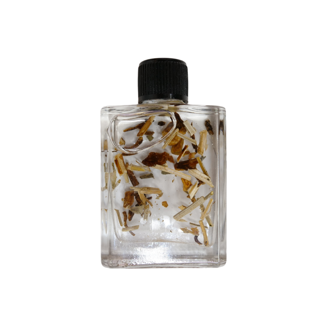 Clear bottle with black cap containing dried herbs on a white background