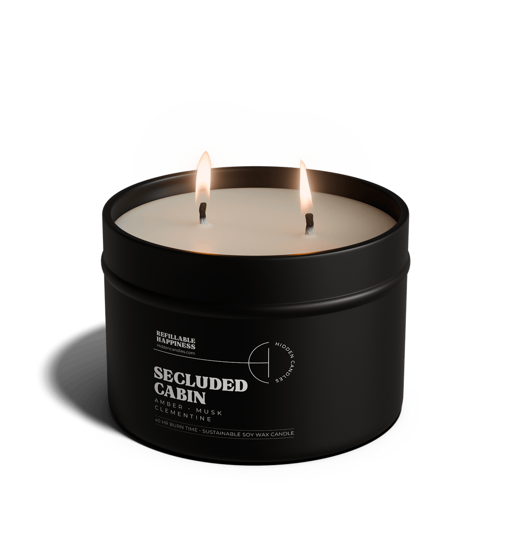 Black candle in a tin labeled 'Vineyard Estate' with a white lid on a transparent background