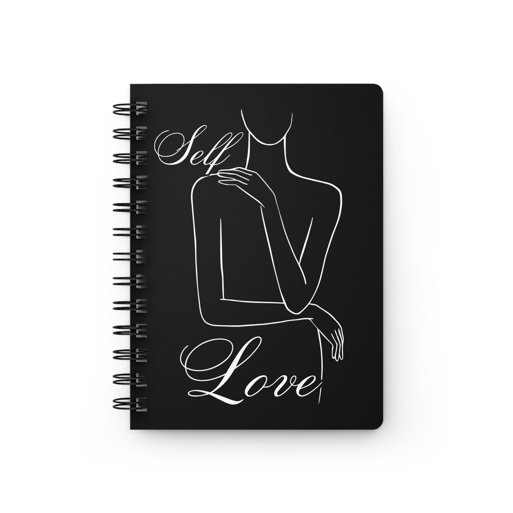 A black spiral-bound notebook with a minimalist white line art illustration of a woman and the words 'Self Love' written in white script on the cover, shown against a plain white background.