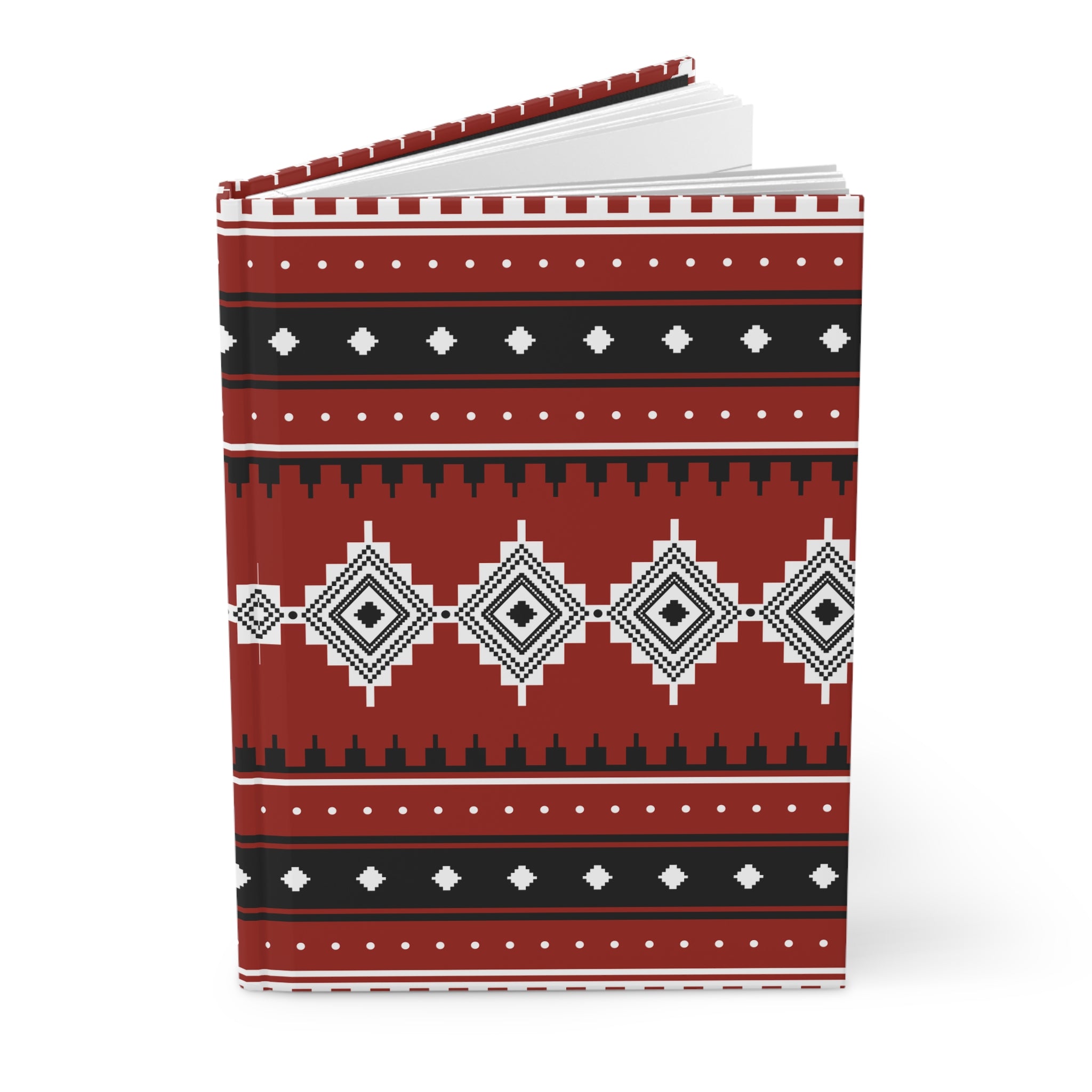 A hardcover notebook with a red, black, and white geometric pattern on the cover, shown open against a plain white background.