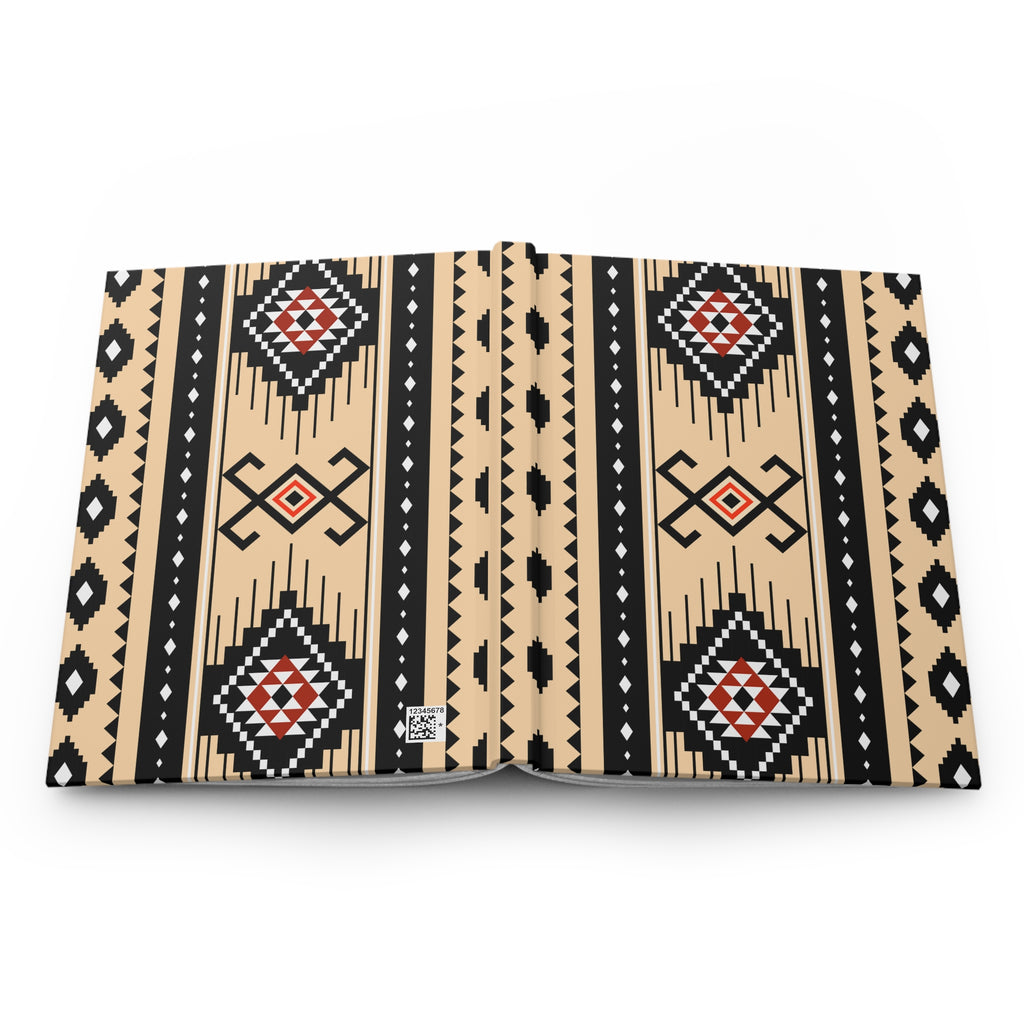 A book or notebook shown open flat against a white background, featuring a bold Southwestern geometric pattern in beige, black, white, and red. A small square logo is visible on the bottom center page.