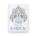 A white hardcover daily journal featuring an illustration of a woman with long flowing hair, blue ornamental details, and gold and blue text reading 'Daily JOURNAL' on the front cover.