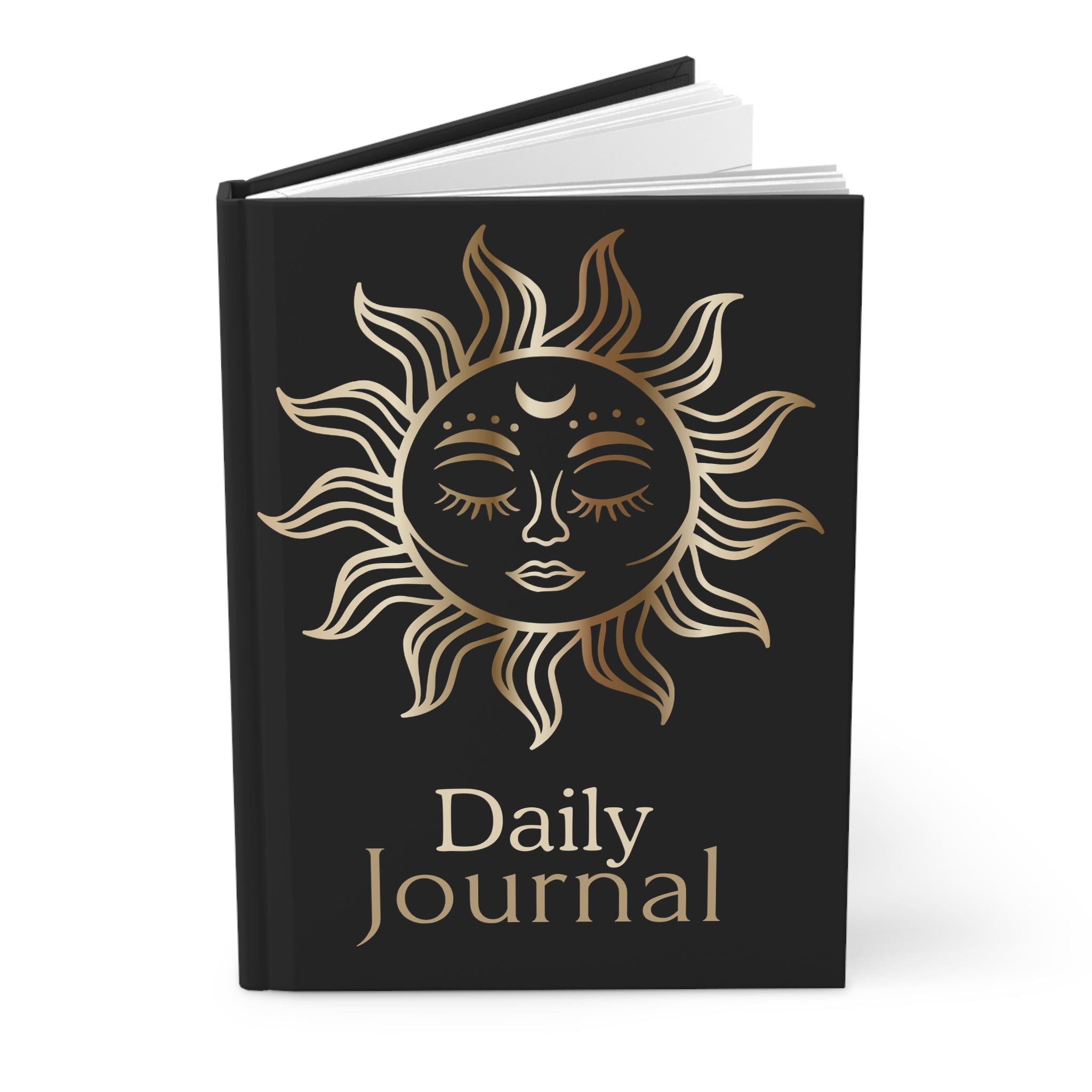 A hardcover daily journal with a black cover featuring a gold sun face illustration and the text 'Daily Journal' in gold, shown open against a white background.