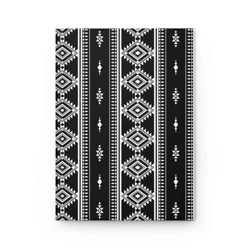 A rectangular black and white geometric patterned item, likely a notebook, journal, or canvas print, featuring vertical tribal-style stripes with diamond and diamond-like motifs, shown against a plain white background.