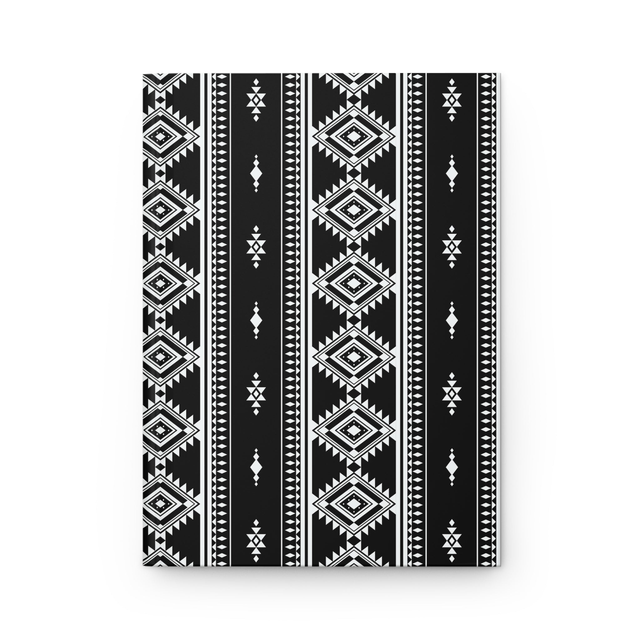 A rectangular black and white geometric patterned item, likely a notebook, journal, or canvas print, featuring vertical tribal-style stripes with diamond and diamond-like motifs, shown against a plain white background.