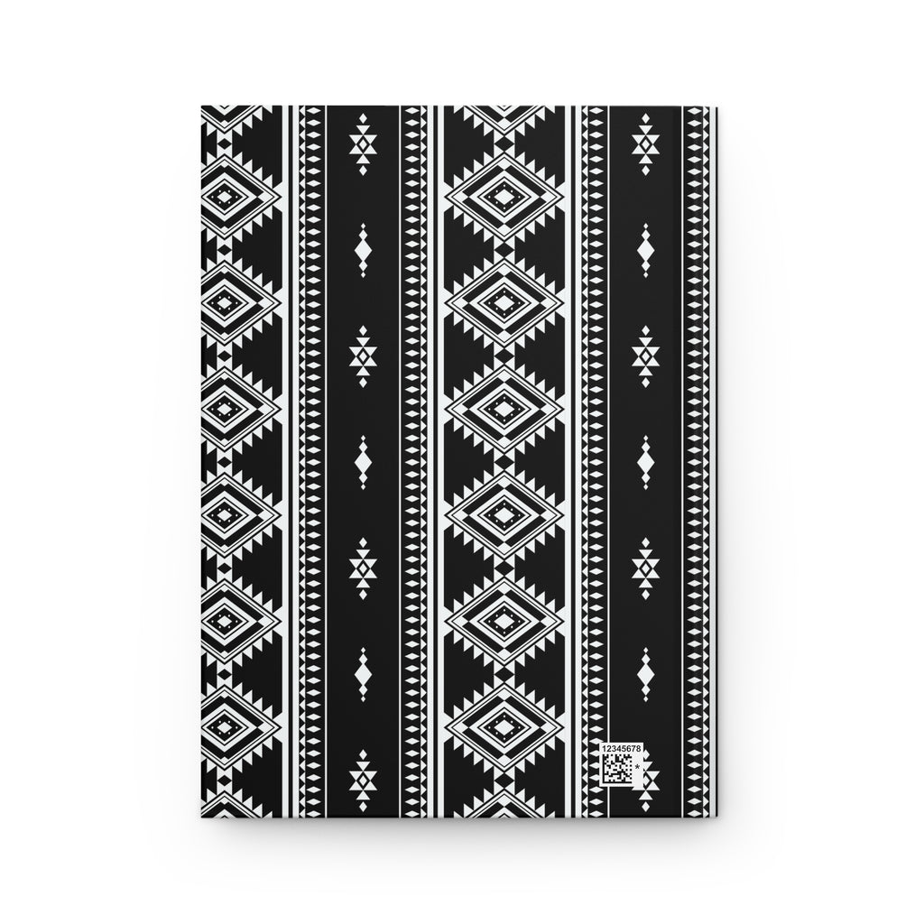 A notebook with a black and white geometric tribal pattern, shown flat against a clean white background.