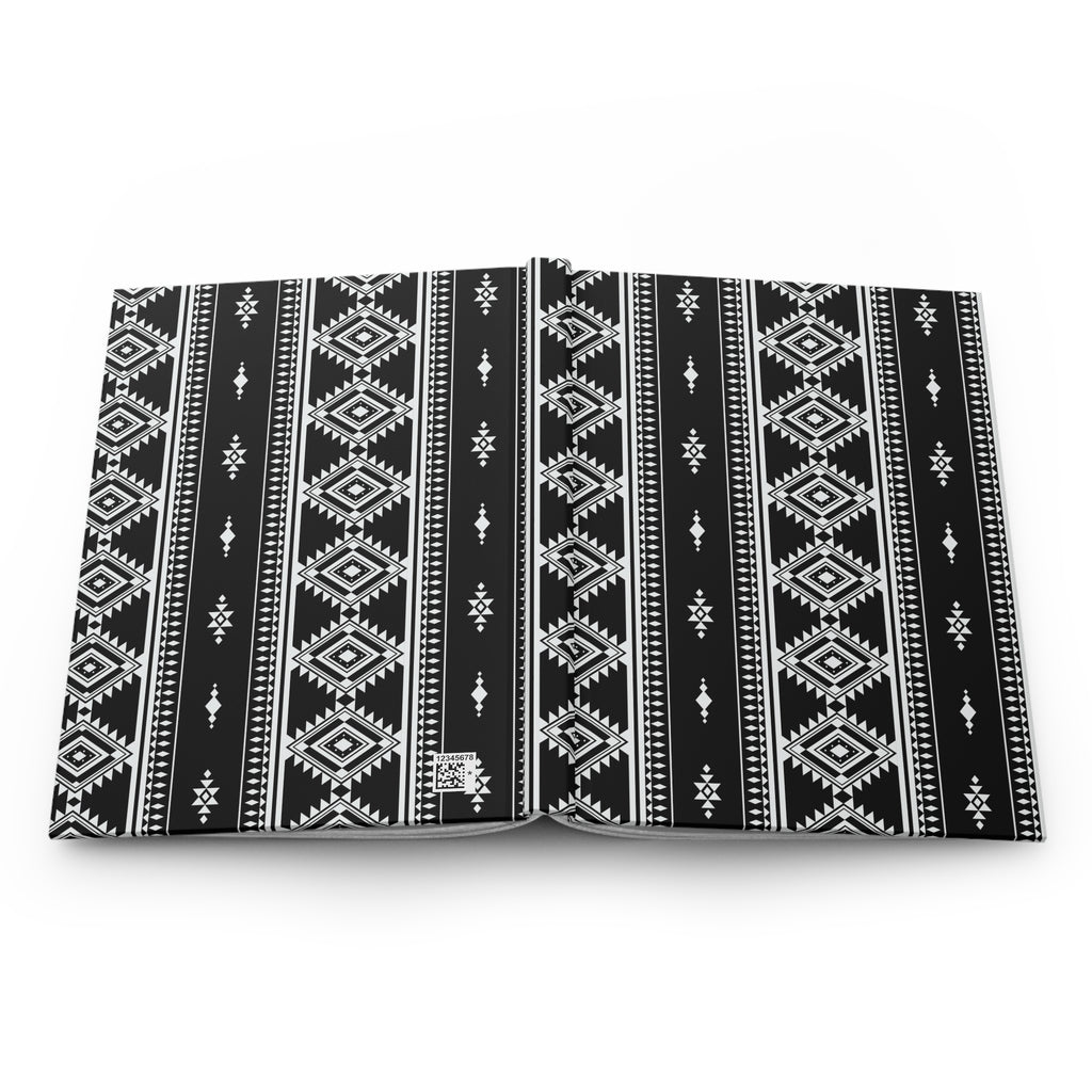 A black and white patterned notebook or book cover with a geometric tribal design, shown open against a plain white background.
