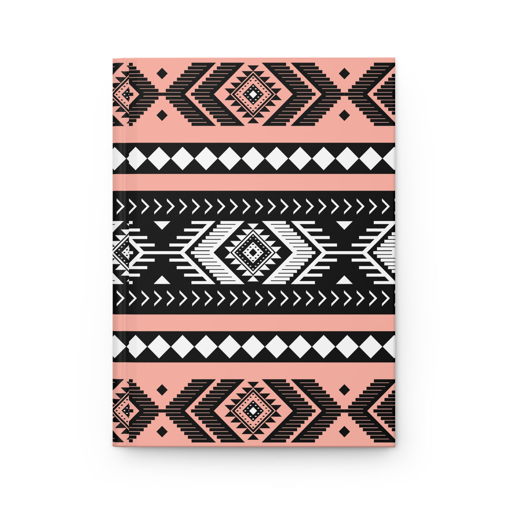 A hardcover notebook with a geometric Southwestern pattern in black, white, and soft pink, shown on a clean white background.