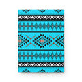 A hardcover notebook with a vibrant turquoise, black, and white geometric Southwestern pattern, shown flat against a clean white background.