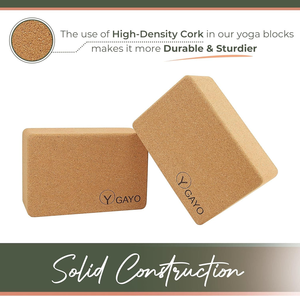 Two cork yoga blocks with 'Y GAYO' branding on a white background, highlighting high-density cork use.