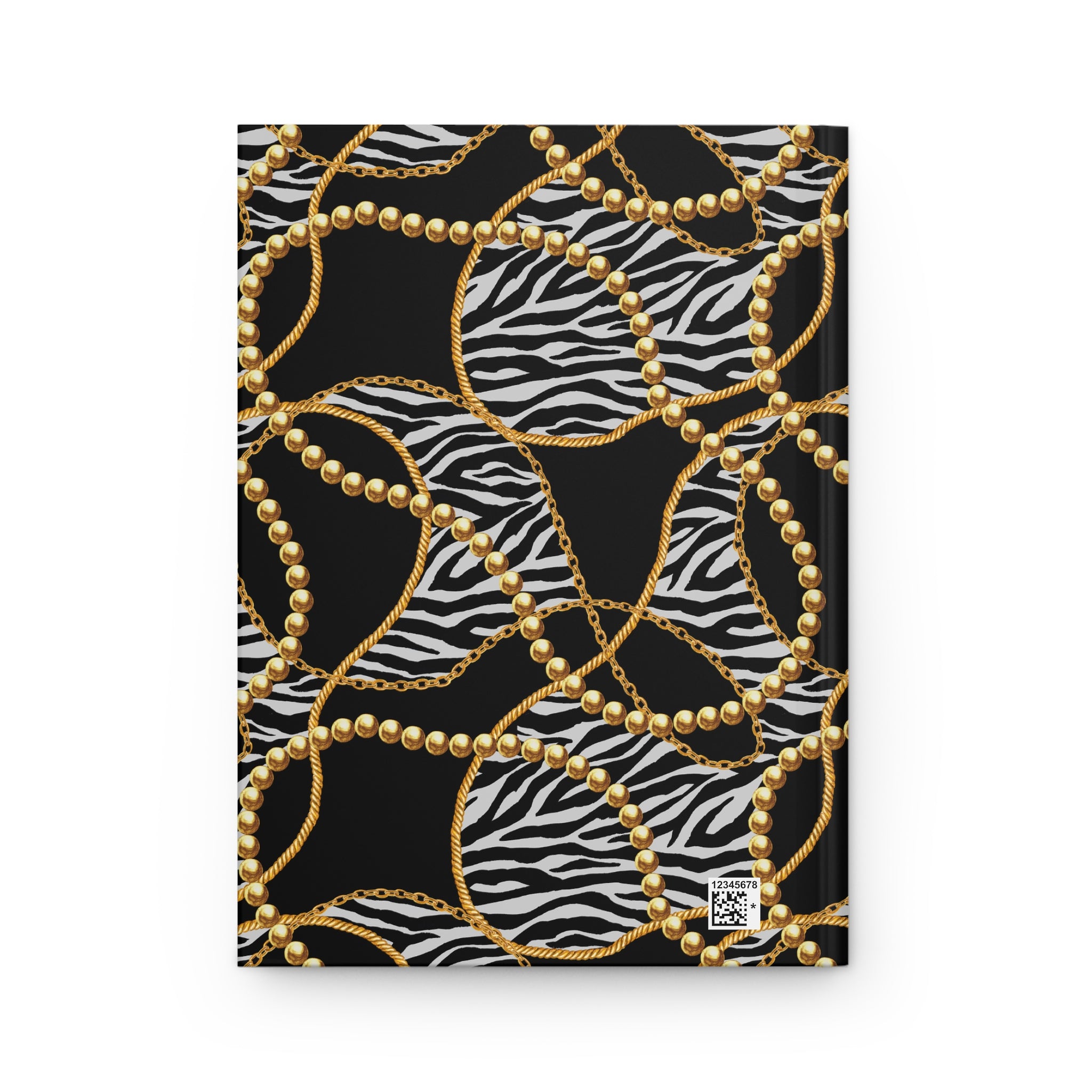 A hardcover notebook featuring a black cover decorated with a zebra print pattern, overlaid with gold chain and gold pearl bead designs, shown on a plain white background.