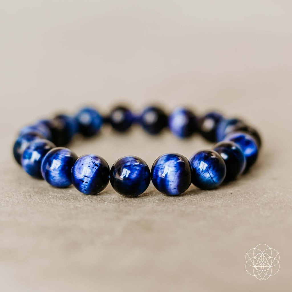 Blue beaded bracelet on a beige background