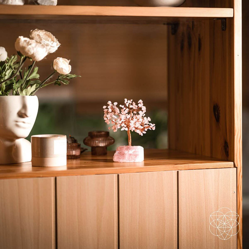 Decorative items on a wooden shelf with a blurred background