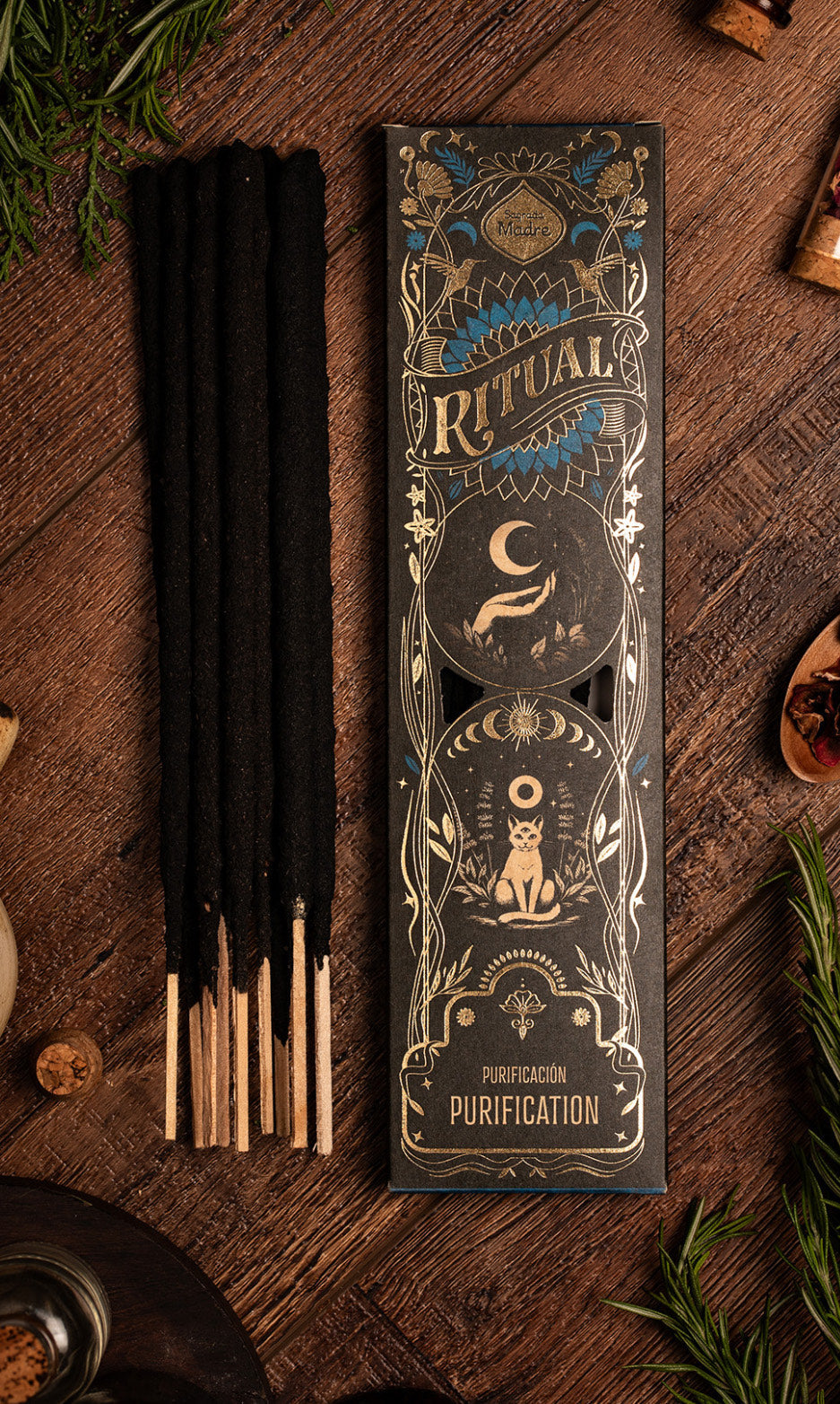 Incense sticks with decorative packaging on a wooden surface