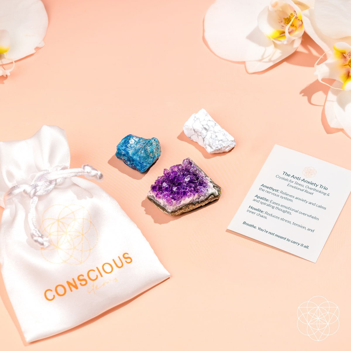 Crystal set with a 'Conscious' pouch on a peach background