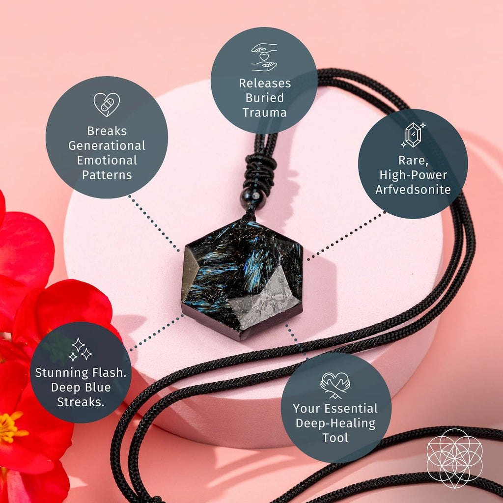 Black corded necklace with a hexagonal pendant on a pink background with red flowers.