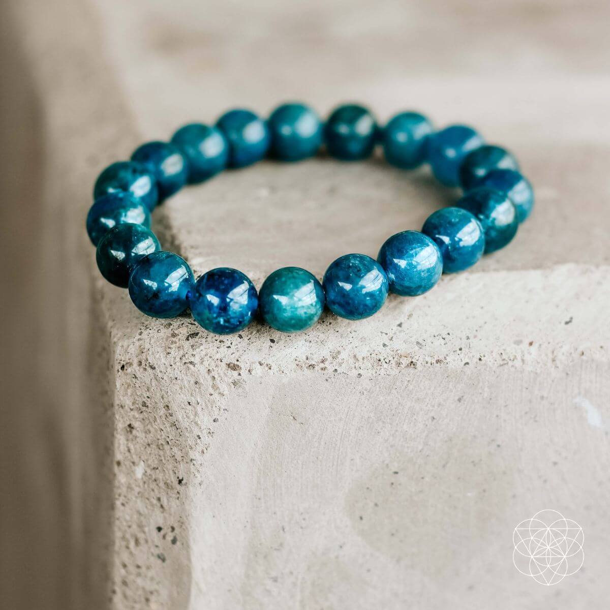 Blue beaded bracelet on a textured surface
