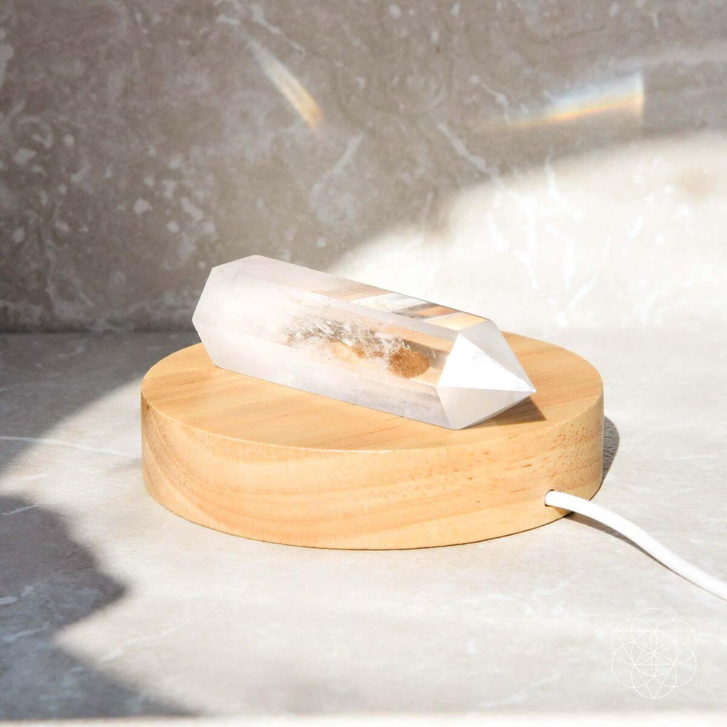 Wooden diffuser with a white plastic bag on a light surface